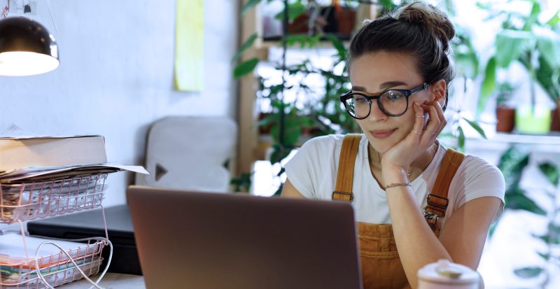 Picture of a woman looking for a job on her computer using different job portals.